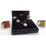 Silver pearl set bracelet and two rhodium plated rings. P&P Group 1 (£14+VAT for the first lot
