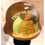WWII German Normandy relic M40 helmet with post war memorial painting. P&P Group 2 (£18+VAT for