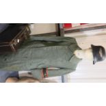WWII German Suitcase, a Great Coat with a Volks Sturm (home guard) Armband and a Luftshutz Helmet.