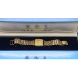 Garrard 9ct gold quartz wristwatch on a 9ct gold bracelet with box and papers, inner and outer