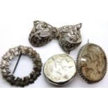 Four presumed silver brooches. P&P Group 1 (£14+VAT for the first lot and £1+VAT for subsequent