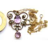 Unmarked gold Edwardian amethyst and seed pearl pendant on a fine 9 ct gold chain. 3.3g. P&P Group 1