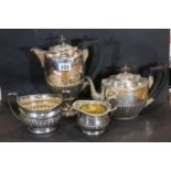 Matched silver plated four piece tea service including Walker and Hall. Not available for in-house
