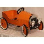 Orange Miffy metal pedal car. 82 cm long, seat 22cm off the ground. In working order at time of