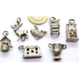 Seven hallmarked silver charms. P&P Group 1 (£14+VAT for the first lot and £1+VAT for subsequent