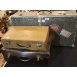 Three vintage travel cases including a tin cabin trunk bearing Cunard shipping labels. Not available