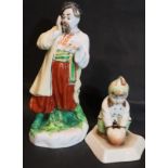 Mid 20thC Russian figurines of a girl with a ball with a further Russian figurine with loss of