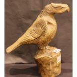 Highly carved Bird of Prey sculpted from a single piece of oak. H: 32cm. P&P Group 3 (£25+VAT for
