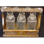 Victorian three decanter oak tantalus with good relief carving. P&P Group 3 (£25+VAT for the first