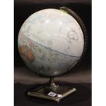 Replogle 12 inch revolving globe on a cast metal base. P&P Group 3 (£25+VAT for the first lot and £