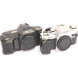 Canon AL-I 35mm SLR camera body (battery camera A/F) and a Canon T70 SLR camera body. P&P Group