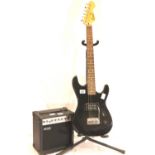 Encore electric guitar and a 10w Acoustic Solutions amp with leads. Not available for in-house P&