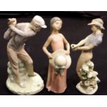 Three Lladro figures, two golfers (lacking clubs) and a girl with hat. P&P Group 3 (£25+VAT for