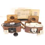 Two novel 1930s British designed Purma film cameras with curved metal focal plane shutter and unique