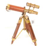 Brass and leather telescope on wooden tripod, H: 35 cm. P&P Group 3 (£25+VAT for the first lot