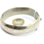 Sterling silver snap bangle, 35g. P&P Group 1 (£14+VAT for the first lot and £1+VAT for subsequent