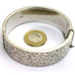 Large hallmarked silver engraved snap bangle, 32g. P&P Group 1 (£14+VAT for the first lot and £1+VAT