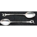 Two Egyptian silver greyhound spoons, marked 80, 20g. P&P Group 1 (£14+VAT for the first lot and £
