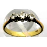 18ct gold ring set with three diamonds, size N, 2.6g. P&P Group 1 (£14+VAT for the first lot and £