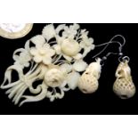 Carved bone ivory brooch and a pair of earrings. P&P Group 1 (£14+VAT for the first lot and £1+VAT