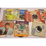 Mixed singles including Elvis, Buddy Holly and Eddie Cochran. Not available for in-house P&P,