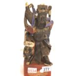 Oriental carved wooden God, H: 33 cm. P&P Group 2 (£18+VAT for the first lot and £3+VAT for