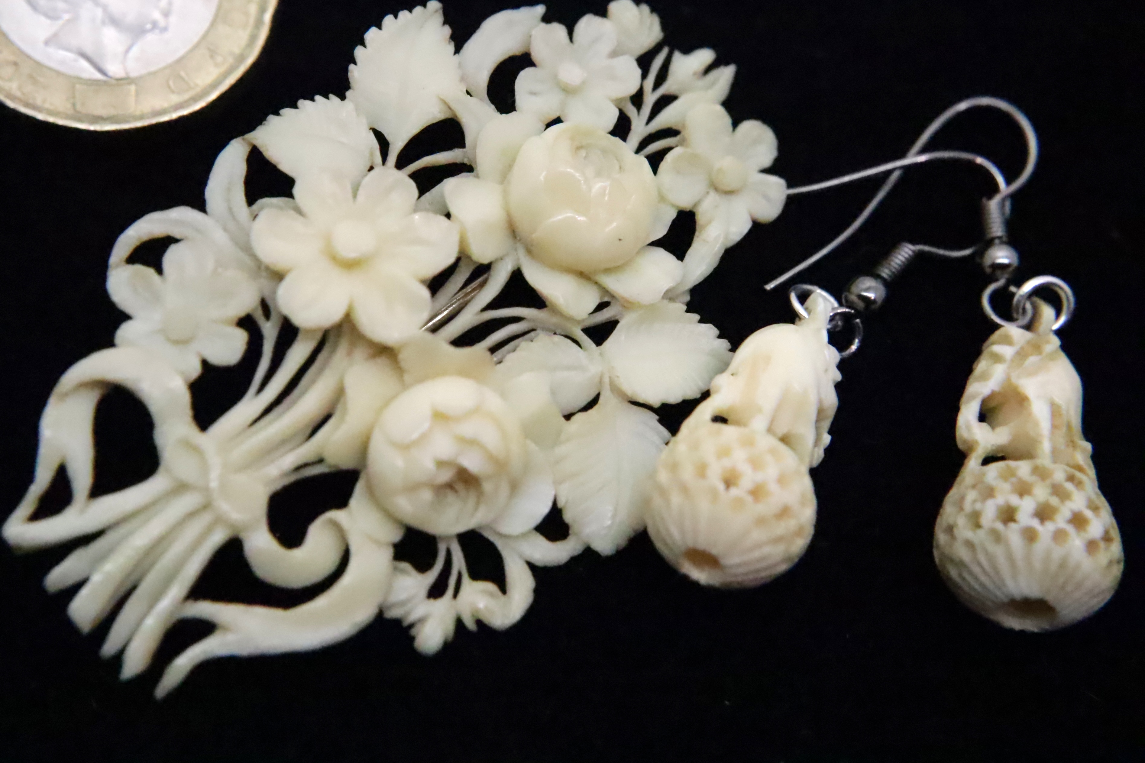 Carved bone ivory brooch and a pair of earrings. P&P Group 1 (£14+VAT for the first lot and £1+VAT