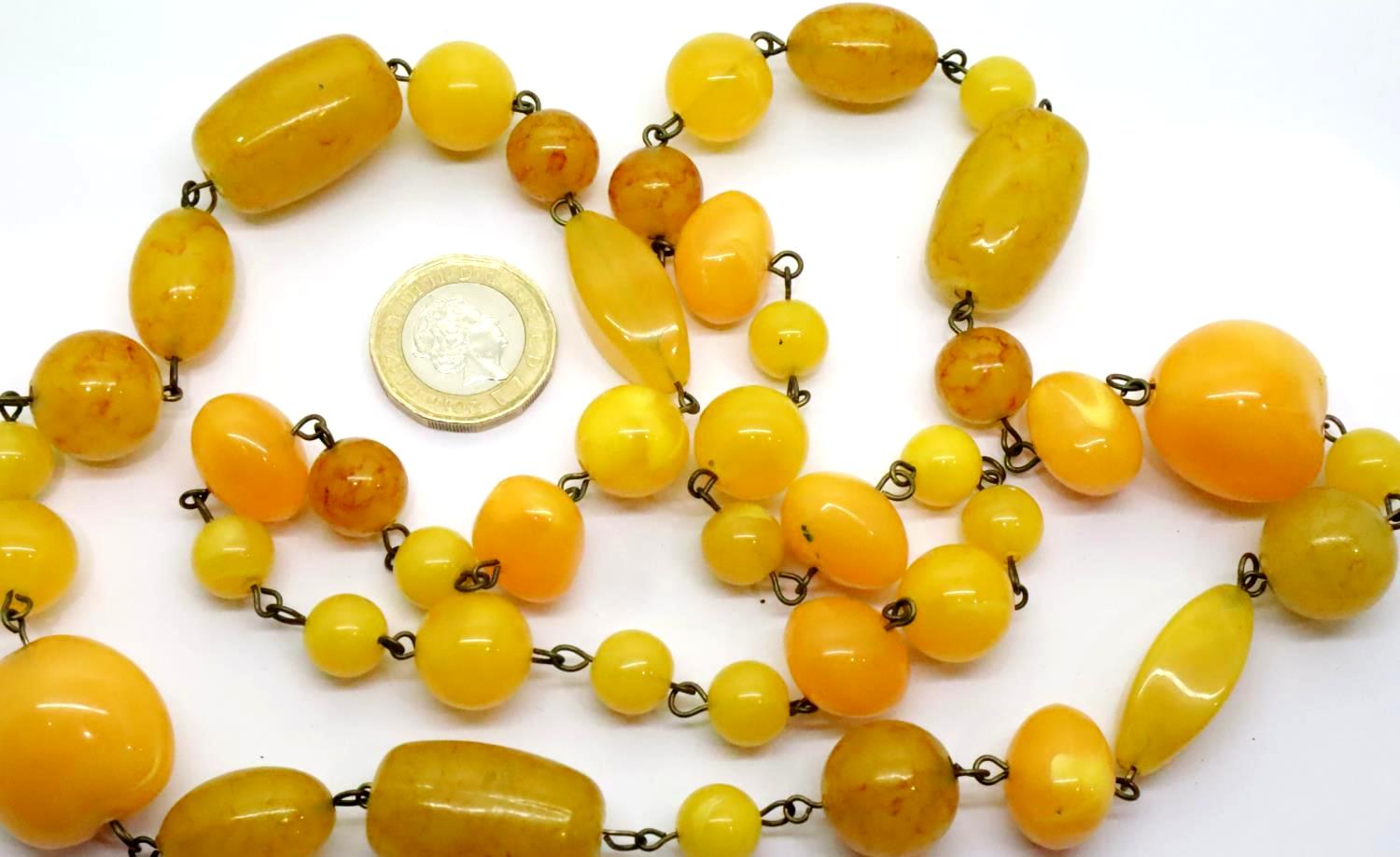 Butterscotch amber necklace of different size beads, largest 25 x 17 mm, combined 81.7g. P&P Group 1