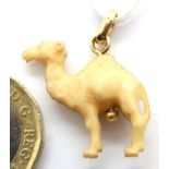 Bone Carved in the form of a camel with a gold bale. P&P Group 1 (£14+VAT for the first lot and £1+