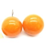 Pair of orb form butterscotch amber earrings, each approximately 20 mm D, combined 11g. P&P Group