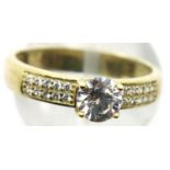 9ct gold solitaire ring with diamond shoulders, size N, 2g. P&P Group 1 (£14+VAT for the first lot