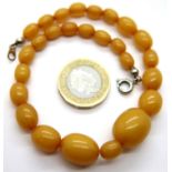 Butterscotch amber bracelet, largest bead 15 x 13 mm, 11g. P&P Group 1 (£14+VAT for the first lot