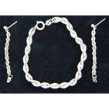 Pair of 925 silver rope earrings and a matching bracelet. P&P Group 1 (£14+VAT for the first lot and