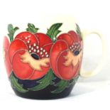 Moorcroft mug in the Meo Voto pattern, H: 9 cm. P&P Group 1 (£14+VAT for the first lot and £1+VAT