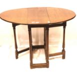 An early 19th century country oak drop leaf table of small proportions. Not available for in-house