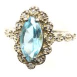Silver ornate blue topaz ring. size N/O. P&P Group 1 (£14+VAT for the first lot and £1+VAT for