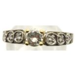 A modern 18ct white and yellow gold solitaire diamond dress ring, the central stone of approximately