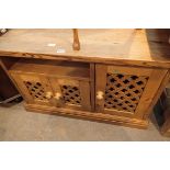 Large stained pine sideboard with fret cut cupboard doors. 104 x 52 x 64cm. Not available for in-