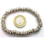Silver elasticated bracelet. P&P Group 1 (£14+VAT for the first lot and £1+VAT for subsequent lots)