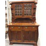 A 19th century Art Nouveau mahogany dresser comprising a base of cupboard and drawers, top section