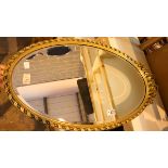 Oval gilt framed bevelled edge mirror. Not available for in-house P&P, contact Paul O'Hea at