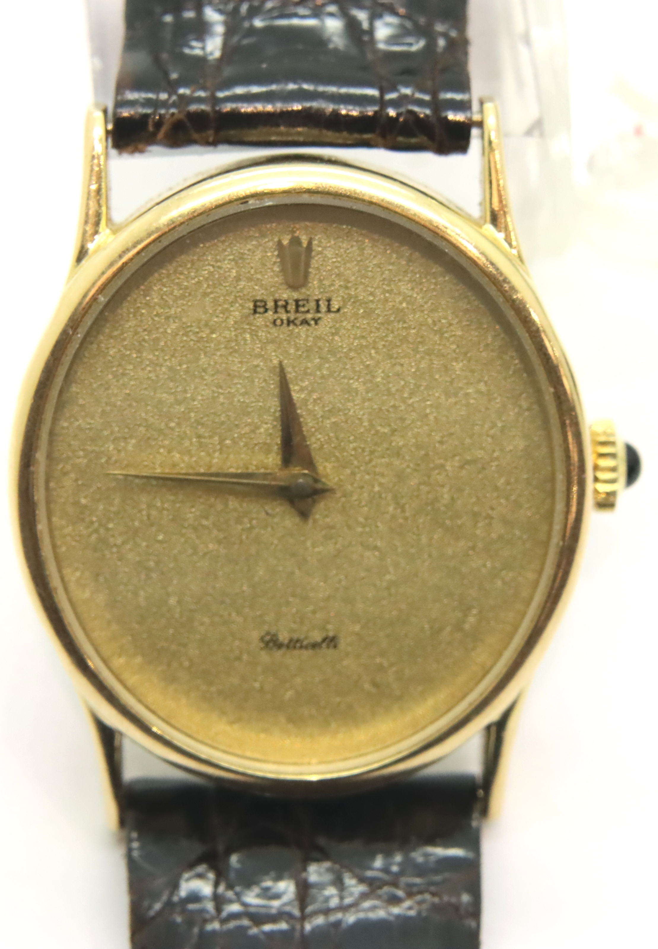 Breil Okay Botticelli ladies Swiss wristwatch, champagne dial, gold hands on brown leather strap.