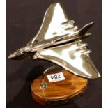 Chrome Vulcan bomber on wooden base, L: 10 cm. P&P Group 2 (£18+VAT for the first lot and £3+VAT for