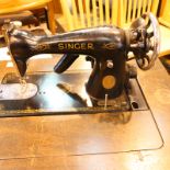 Treadle singer sewing machine with metal frame support changed to electricity. Not available for