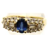 A Contemporary 18ct gold Sapphire and Diamond set cocktail ring, the single central oval sapphire of