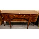 Regency mahogany bow fronted buffet, with two long drawers flanked by two cupboard doors,
