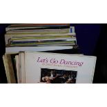 A box of mixed vinyl records to include Lets Go Dancing and Tickled Pink. Not available for in-house