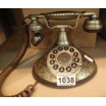 The Duchess; a push button telephone with a solid, brass finish and traditional cloth handset