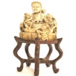 Antique ivory carving of Chinese immortals and pheasants on a hardwood stand, H: 7 cm. P&P Group