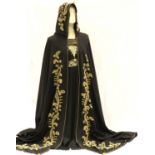 Hooded black cape with gold embroidered design. P&P Group 1 (£14+VAT for the first lot and £1+VAT